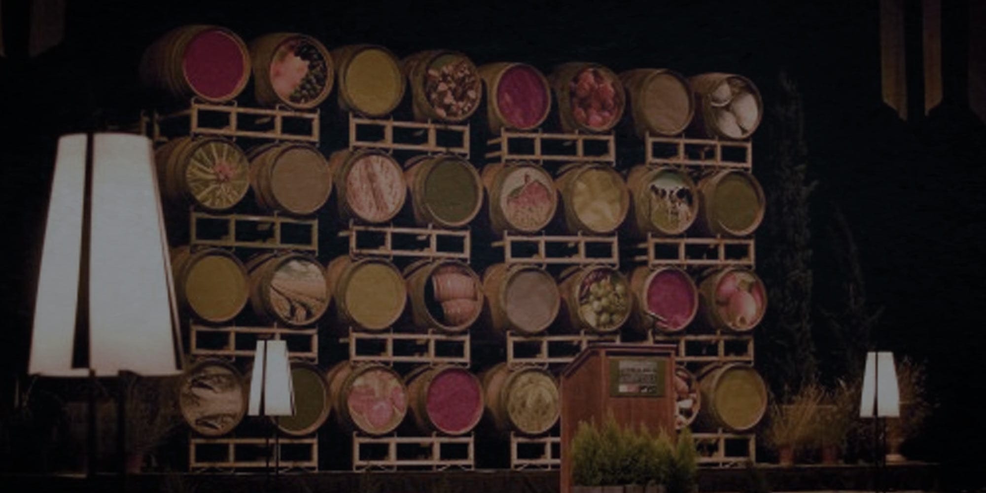 wine festival banner of stacked barrels on a stage