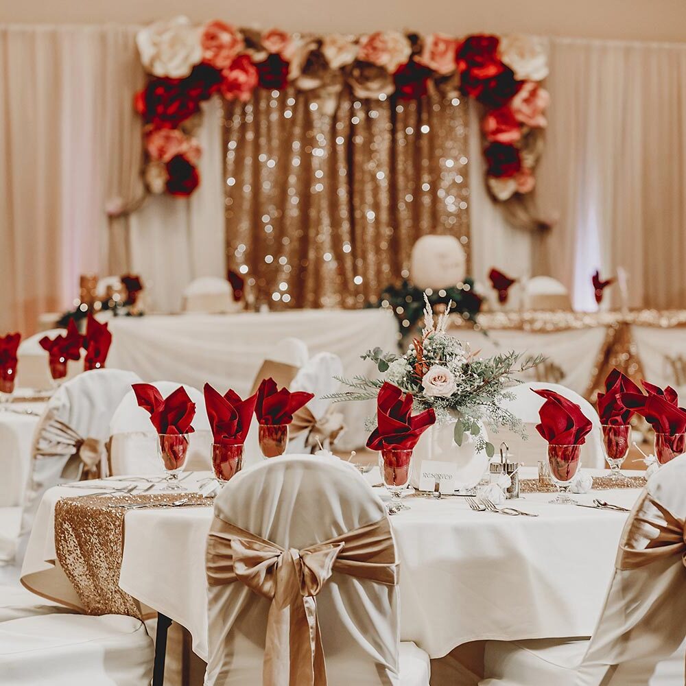 Elegant wedding reception with floral decorations.