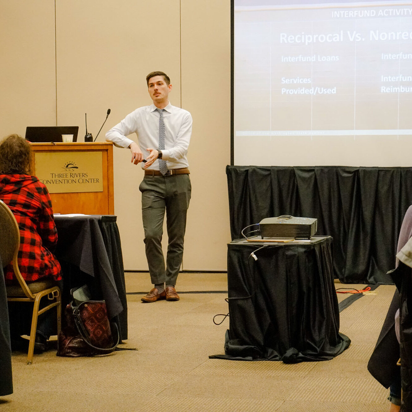 Person presenting about reciprocal vs. nonreciprocal funds.